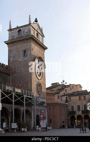 The Torre dell'Orologio (Clock Tower) in Mantua, Italy. The tower overlooks the Piazza delle Erbe public square. Stock Photo