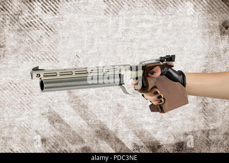Sport laser pistol, pentathlon weapons. gun in female gloved hands Stock Photo