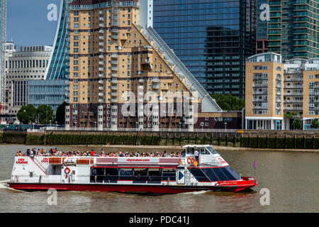 A City Cruises River Cruise Boat Out On The River Thames At Canary Wharf, London, England