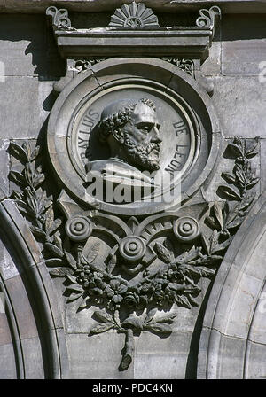 Fray Luis de Leon (Belmonte, 1527-Madrigal de las Altas Torres, 1591). Spanish poet. Relief on a medallion. Facade of the National Library, detail. Madrid, Spain. Stock Photo