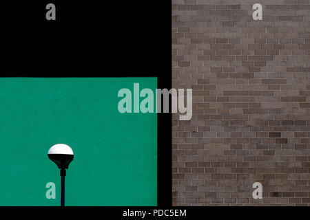 A lamp with both a green and a grey wall Stock Photo