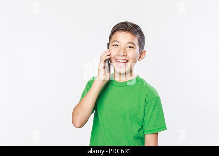 Young boy in a conceptual photo of talking on the cell phone. Stock Photo