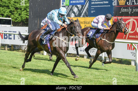 Brighton UK 8th August 2018 - Pastoral Player ridden by Charlie Bennett (left) romps home to win the Bombardier Brighton Mile Challenge Trophy at the Brighton Races Marathonbet Festival of Racing Marstons Opening Day  Credit: Simon Dack/Alamy Live News Stock Photo