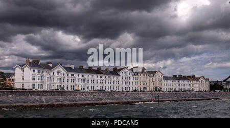 Exmouth, Devon, UK. 8th August, 2018.  Weather the storm - dark clouds gather over the seafront houses and hotels at Exmouth, Devon. Stock Photo