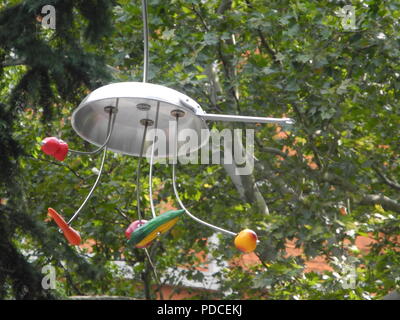 New York, USA. 07th Aug, 2018. Trees made of frying pans, cooking pots and drip strainers by the US artist Bill Wurtz, who usually only appears as B. Wurtz. They are part of the exhibition 'Kitchen Trees' and are located in the park in front of the city council. Credit: Johannes Schmitt-Tegge/dpa/Alamy Live News Stock Photo