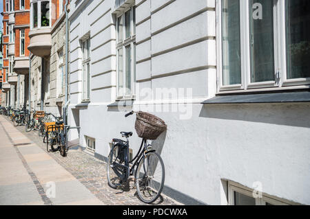 urban scene with bicycles parked on street in copenhagen, denmark Stock Photo