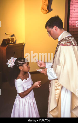 Child receives Holy Communion MR.  © Myrleen Pearson  .....Ferguson Cate Stock Photo