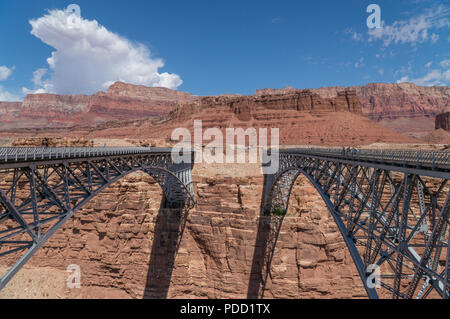 The Glen Canyon Dam Bridge arching across the red rock above the Colorado River in Page, Arizona. Stock Photo