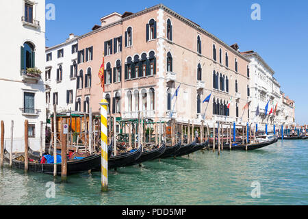 Gondolas outside the Gritti Palace Hotel, Grand Canal, Venice, Veneto, Italy at the Santa Maria del Giglio gondola station in San Marco Stock Photo