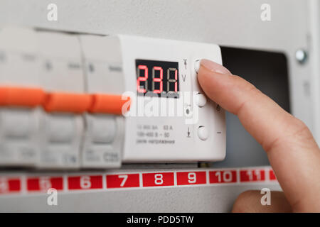 Electrical terminal box. man turn on or off Stock Photo