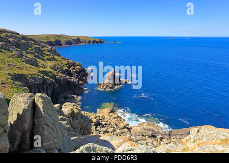 Distant Longships Lighthouse off Land's End from Mayon Cliff on the South West Coast Path, Sennen, Cornwall, England, UK. Stock Photo