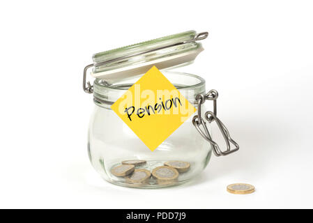 Slush fund: glass clip top Kilner storage jar with British one pound coins and stickie post-it note with Pension Stock Photo