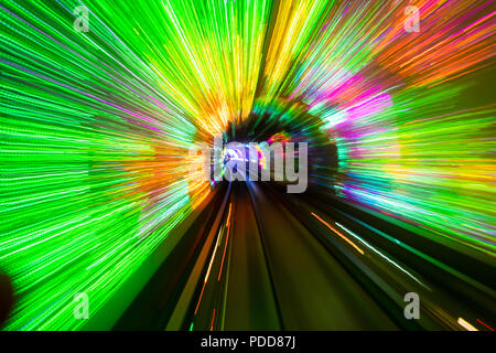 Light streaks. Long exposure from train passing through Bund Sightseeing Tunnel in Shanghai Stock Photo