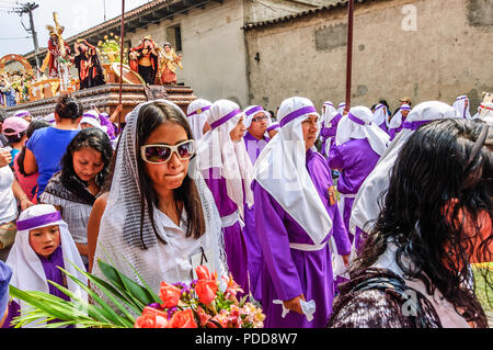 Antigua, Guatemala -  April 1, 2012: Palm Sunday procession in Spanish colonial town & UNESCO World Heritage Site with famous Holy Week celebrations. Stock Photo