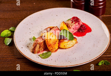 juicy meat with baked potatoes Stock Photo