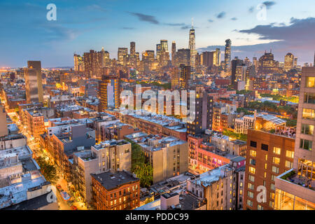 New York, New York, USA Financial district skyline from the Lower East Side at dusk. Stock Photo