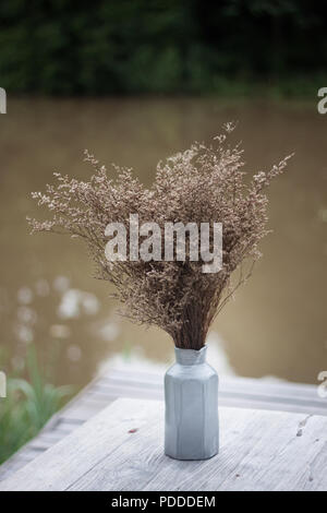 Bouquet of dried flowers in vase on table, stock photo Stock Photo