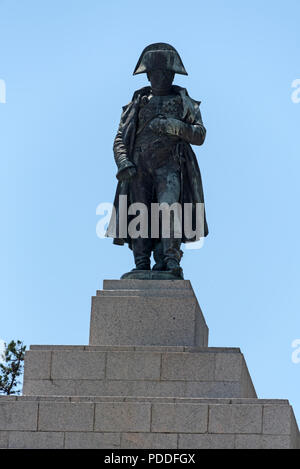 A giant statue of Napoleon Bonaparte, Ajaccio born and France’s first emperor on top of a granite shaped pyramid in a park of olive trees, Place d’Aus Stock Photo