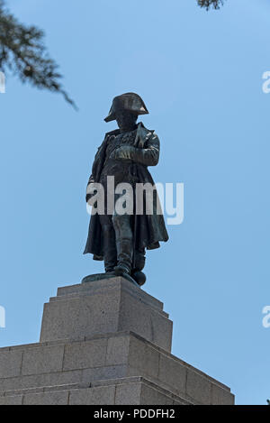 A giant statue of Napoleon Bonaparte, Ajaccio born and France’s first emperor on top of a granite shaped pyramid in a park of olive trees, Place d’Aus Stock Photo