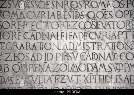 Ancient writings in Latin language of religious texts, very common in religious and historical buildings of many Italian cities. Stock Photo