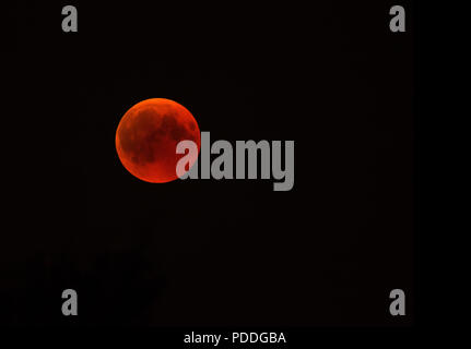 The total eclipse of the moon in July 2018, so-called bloody moon. Poland, horizontal view with copy space on the right side. Stock Photo