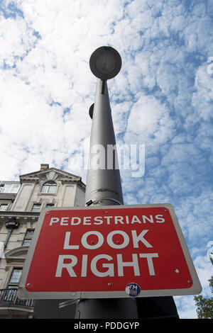 I Look In/sign Look Right road sign signage in English and Chinese language in Hong ...