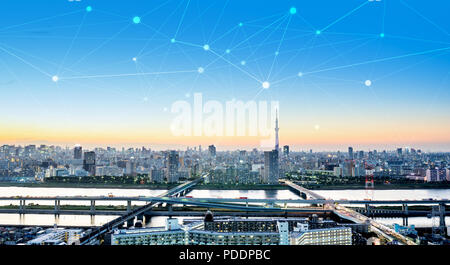 Business concept for information, communication , connection technology - panoramic modern city skyline bird eye aerial night view under dramatic glow Stock Photo