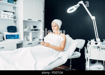 Patient in face mask, getting rid of wrinkles Stock Photo