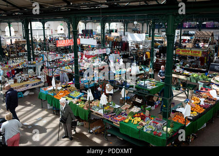 View over stalls inside a city centre market Stock Photo