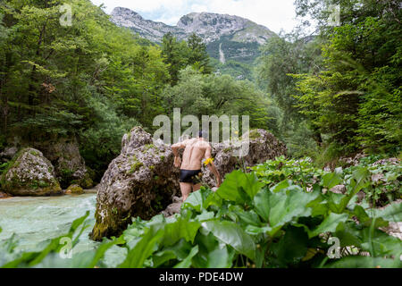 A man swimming in the river of beautiful nature Stock Photo