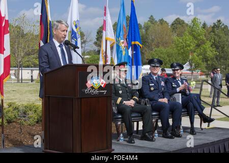 Canadian Parliamentary Secretary Andrew Leslie offers remarks from the Prime Minister, Justin Trudeau to open the North American Aerospace Defense Command’s 60th Anniversary Ceremony on Peterson Air Force Base Colorado, May 12. The ceremony and static display of various NORAD aircraft was the culmination of a three-day event, which included a media tour of Cheyenne Mountain Air Force Station, the dedication of a cairn outside the commands’ headquarters building memorializing the Canadians who have passed away while serving NORAD, and a fly over in missing-man formation performed by the Royal C Stock Photo