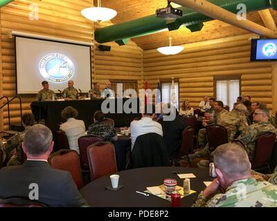 Senior military leaders speak on a panel about the National Guard's role in the U.S. military’s cyber mission force May 16, 2018, as part of Cyber Shield 18, in Camp Atterbury, Ind., an exercise bringing together more than 800 soldiers, airmen, and civilians from 40 states and territories to test their skills in response to cyber-incidents. The panel included (from left to right) Maj. Gen. Stephen G. Fogarty, the commander of U.S. Army Cyber Command, Maj. Gen. James E. Taylor, the special assistant to the Director of the Army National Guard for Operations, Plans, and Strategy, Brig. Gen. Neil  Stock Photo