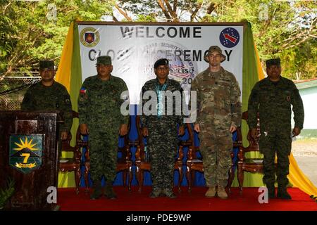 (From left to right) Philippine Army Lt. Col. Arnel Cabugon, commander of the 48th Infantry Battalion; Philippine Army Col. Laurence Mina, commander of the Joint Task Force Salaknib; Philippine Army Brig. Gen. Corleto Vinluan, commander of the Light Reaction Regiment; U.S. Army Lt. Col James Hart, commander of 1st Battalion, 21st Infantry Regiment, 2nd Infantry Brigade Combat Team, 25th Infantry Division and Philippine Army Lt. Col. Antonio Burton, commander of the 42nd Mechanized Forces, stand to honor the service members who have participated in Exercise Balikatan during the closing ceremony Stock Photo