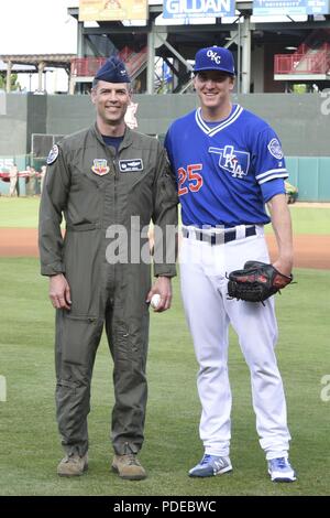 Col. Geoffrey Weiss, 552nd Air Control Wing commander, and Josh Sborz,  Oklahoma City Dodgers pitcher, pose together after Weiss threw out the first pitch to open the game for the teams Military Appreciation Night at Chickasaw Bricktown Ballpark May 18, 2018, Oklahoma City, Oklahoma. Free tickets were given to military members and their families with the ceremonial first pitch being thrown out by a unit commander, a giant American flag displayed on the field by military members and various demonstrations of military working-dog capabilities to the crowd. The OKC Dodgers are a Triple-A affiliat Stock Photo