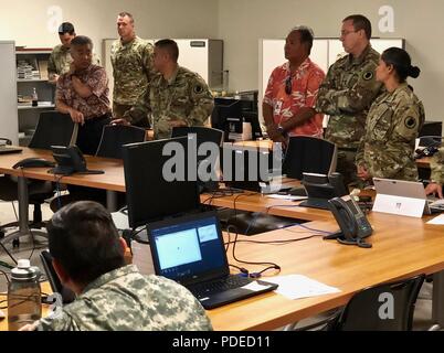 Brig. Gen. Kenneth S. Hara briefs David Ige, Governor, State of Hawaii, on Task Force 5-0's operations in support of Hawaii County government agencies in response to the volcanic outbreak on Hawaii Island since May 3. Stock Photo