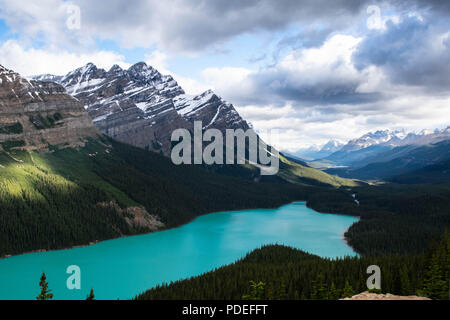 Arriving at Moraine Lake in Banff, Alberta just as the sun began to rise and tickle the clouds above the Valley of the Ten Peaks. Stock Photo