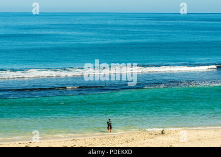 A fisherman casts his line into the lagoon at Yanchep, Western australia Stock Photo