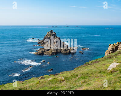 Armed Knight rock formation and Longships Lighthouse at Land's End, Cornwall, England Stock Photo