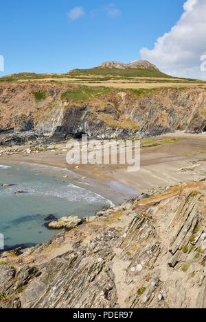 Rugged rocky bay next to Whitesands Beach in Pembrokeshire South Wales on a sunny clear day with white puffy clouds Stock Photo