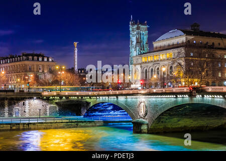 Twilight view onto the Seine at pont au Change bridge and the guilded and winged Statue de la Victoire or Victory Statue in Paris France Stock Photo
