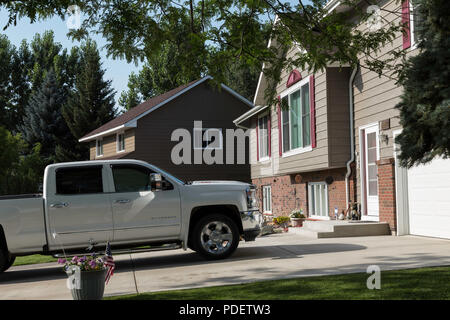 Residential House Exterior in Middle Class Neighborhood, MT, USA Stock Photo