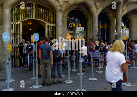 Barcelona, Spain Casa Batllo entrance. Tourists waiting in line outside Casa dels ossos (House of Bones) building designed by Antoni Gaudi. Stock Photo