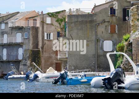 Closeup of old houses with pleasure boats at the seaside Stock Photo