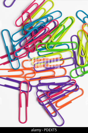 Colored paper clips on white backgound Stock Photo