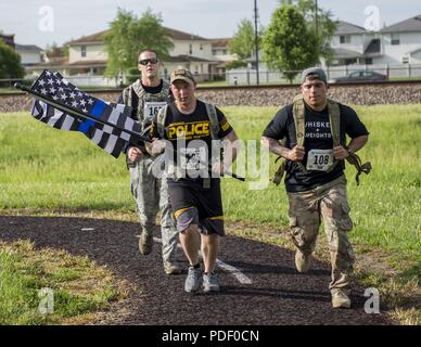 The 375th Security Forces Squadron held the Police Memorial 5K Fun Run at Scott Air Force base, Ill., May 15, 2018. The event was held as part of National Police Week to pay tribute to officers who have died or have been injured in the line of duty. Other events planned for the week include a Top Gun Shooting Competition, golf scramble, softball tournament and K-9 competition. Stock Photo