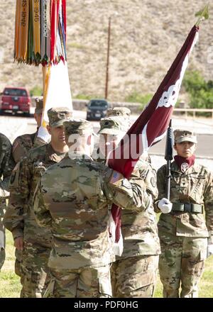 Col. Christopher Lindner, acting commander, William Beaumont Army Medical Center, receives Troop Command’s colors from Lt. Col. Steven Knapp, outgoing commander, Troop Command, WBAMC, during a change of command ceremony where Knapp relinquished command to Lt. Col. Kathleen Chung at WBAMC, May 18. Troop Command is responsible for administrative actions and training of over 1,200 Soldiers assigned to WBAMC including three companies, one student detachment and six external clinics located on Fort Bliss and El Paso. Stock Photo