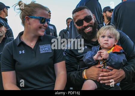 U.S. Army Pfc. Lauren Jahn and Veteran Sgt. Christopher McGinnis, Team Army Competitors, pose for a Stock Photo