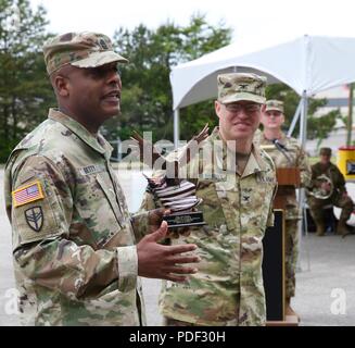 Col. John Dreska, outgoing 1st Brigade commander (right), passes the ...