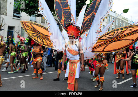 Performers wearing colourful costumes. Notting Hill Carnival. London, United Kingdom. Stock Photo