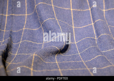Checkered scarf is dark blue . Plaid scarf Royal Stuart plaid with fringe. Stock Photo
